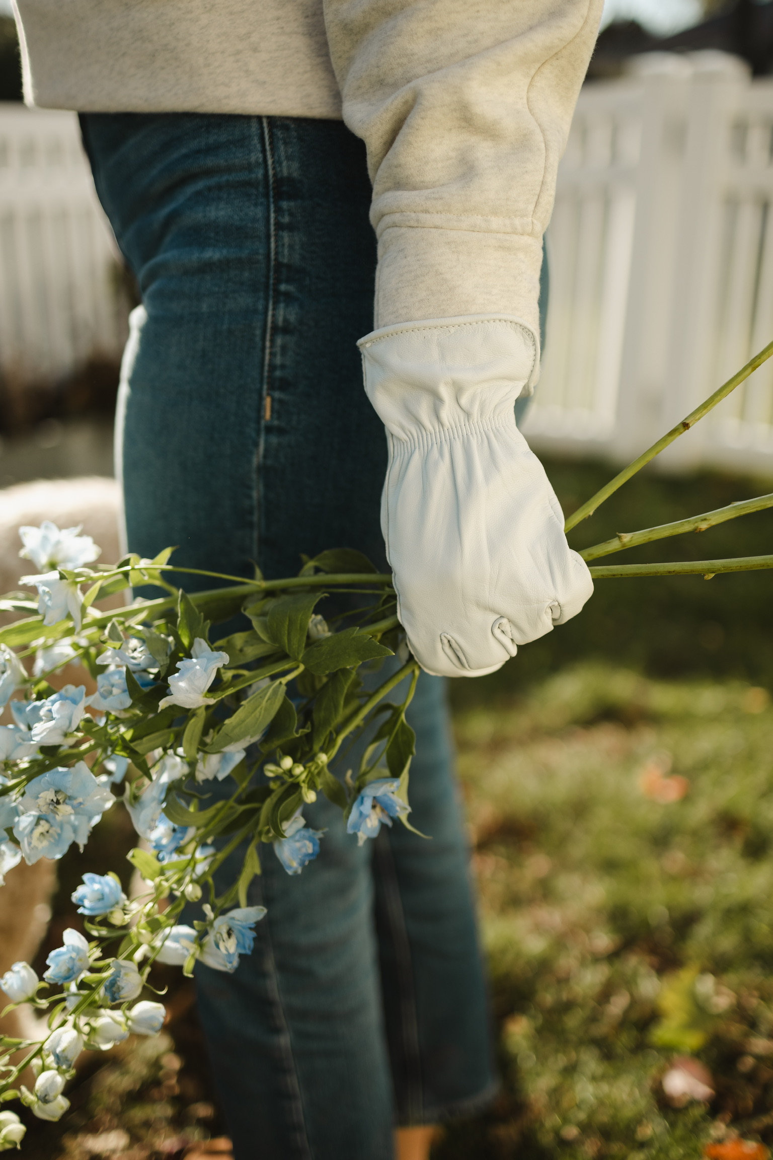 DRIFTWOOD GLOVE WITH FLOWERS IN ONE HAND