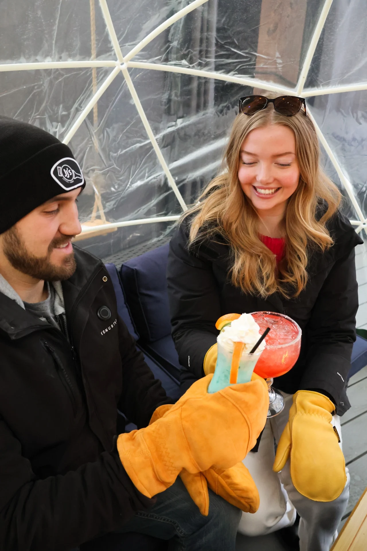 Cedar Frost 8 People smiling with orange cedar frost Saranac winter gloves
