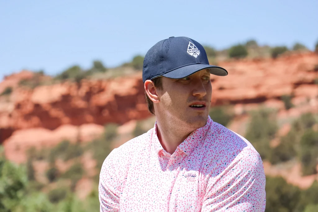 Person Wearing Saranac Golf Hat