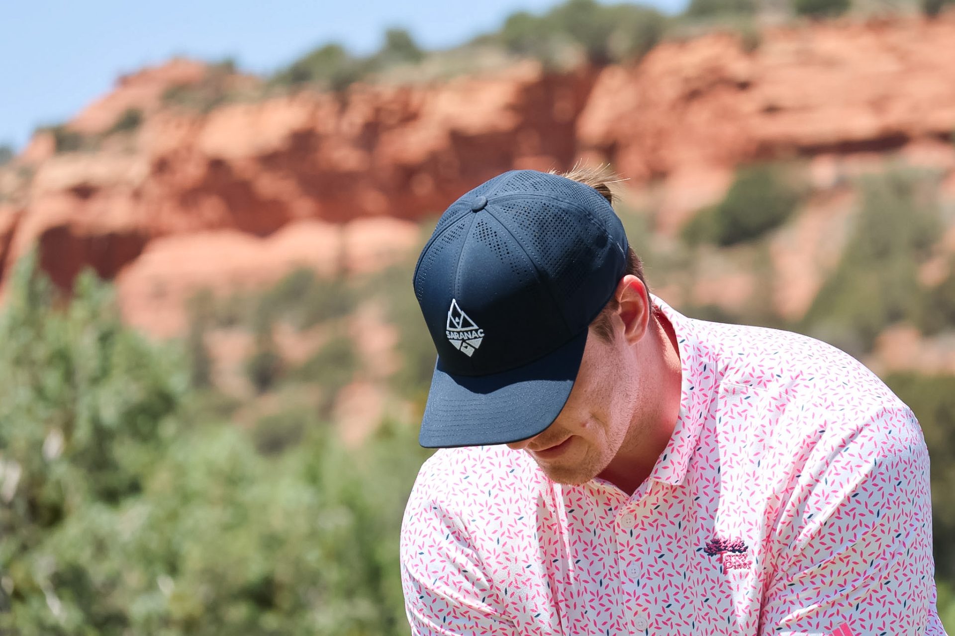 Golfer Wearing Saranac Golf Hat
